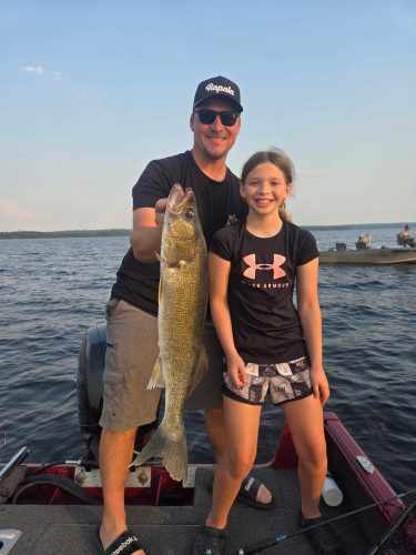 Father and daughter catching fish