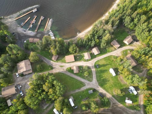 Aerial view of lakeside cabins.