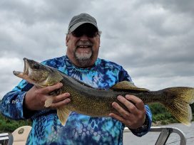 Happy Fisherman With His Walleye Catch