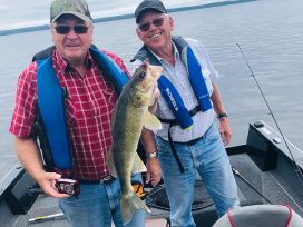 Two Guests Holding Up Walleye